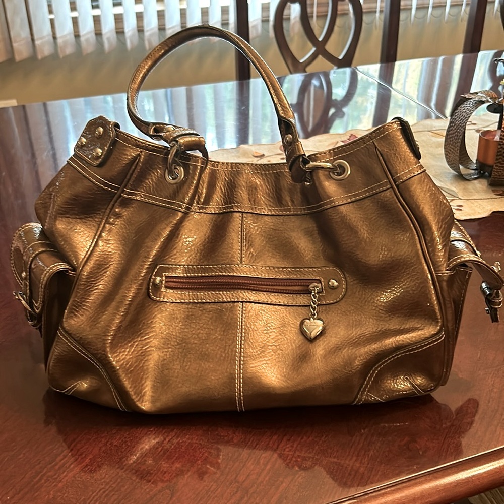 Chrome, Kathy bag, great condition. Lots of storage pockets, cell phone pockets.